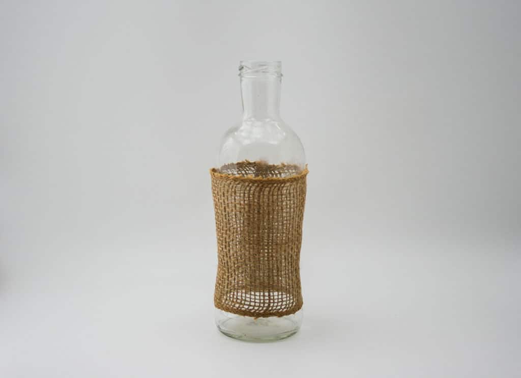 Bottle with burlap wrapped around