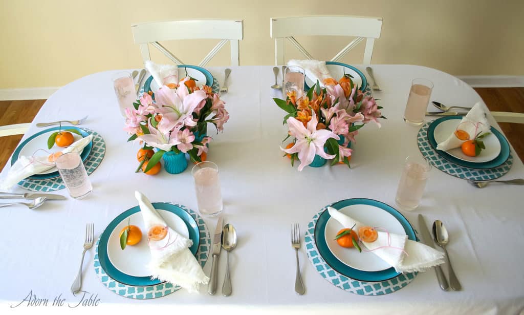 Centerpieces three ways -table setting with two flower arrangements in the middle of the table