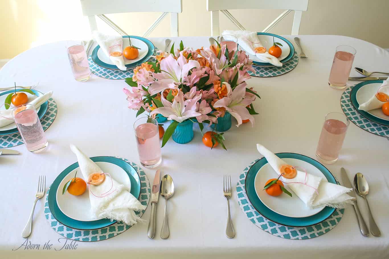 Centerpieces three ways - table setting view from above with 6 teal diy vases in the middle