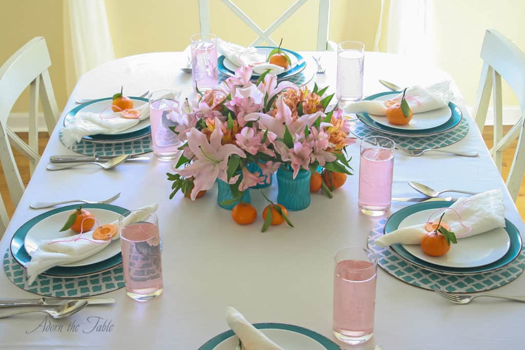 Centerpieces three ways - table setting with 6 teal vases in a circle