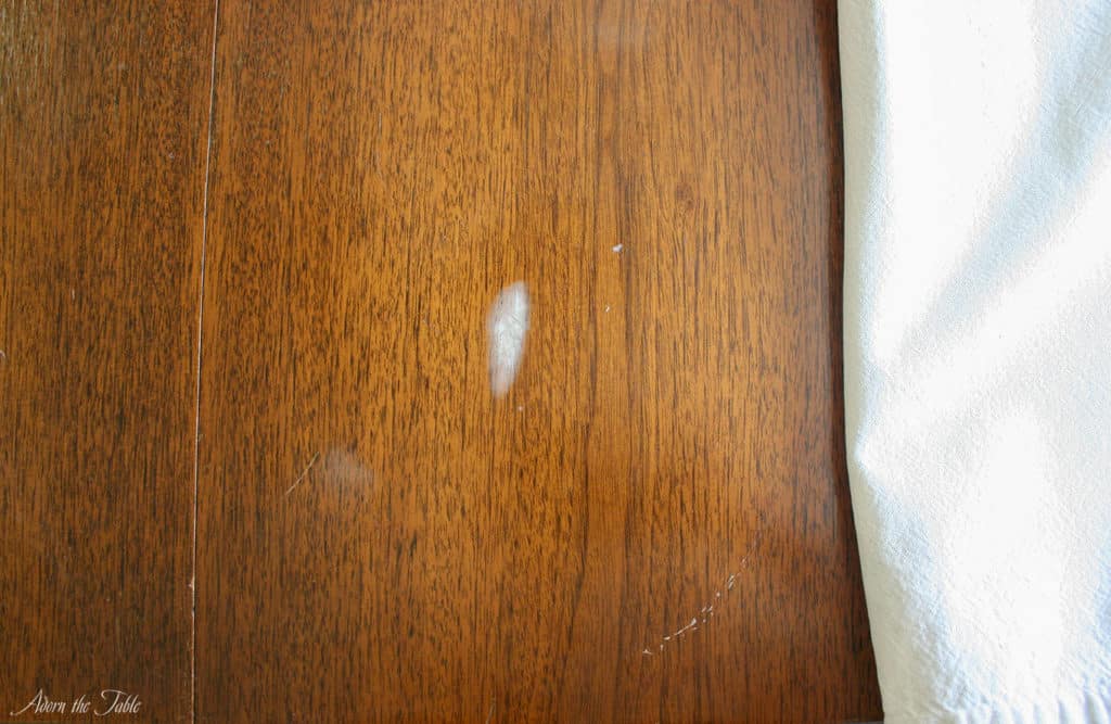 Hazy white stain on old table-1st pass