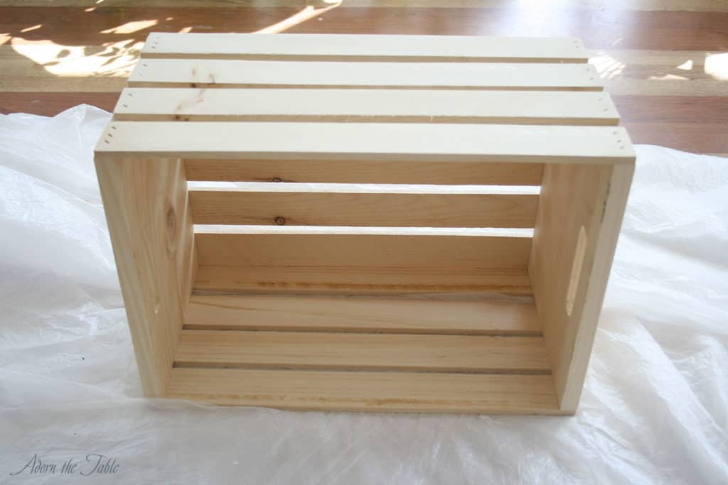 Wooden crate on plastic drop cloth