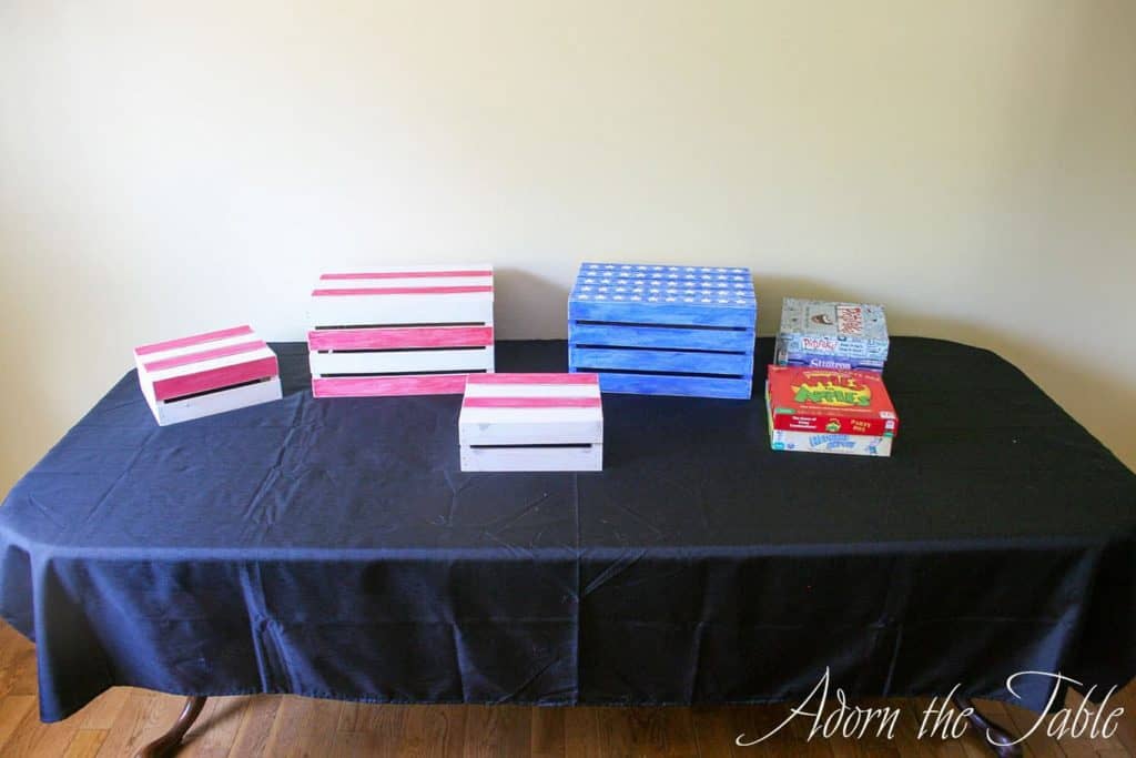 Graduation-Buffet-Table-black tablecloth with crates and game boxes