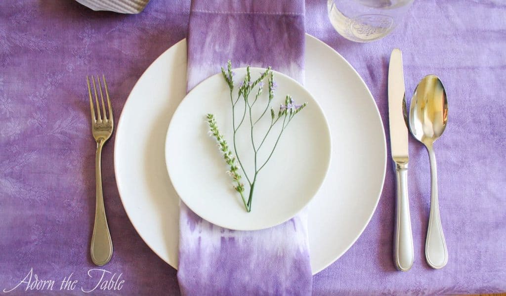 Close up of boho place setting flower sprigs