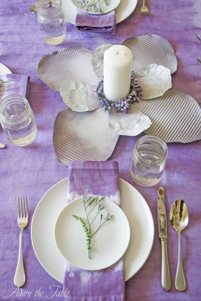 DIY cookie sheet flower on lilac tie-dyed tablecloth