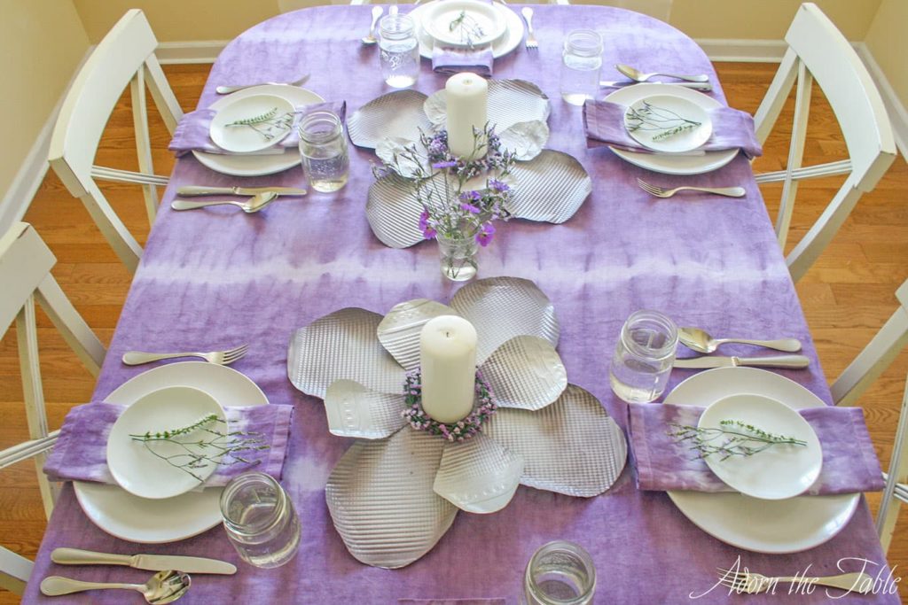 View of lilac and white tablescape from front of the table