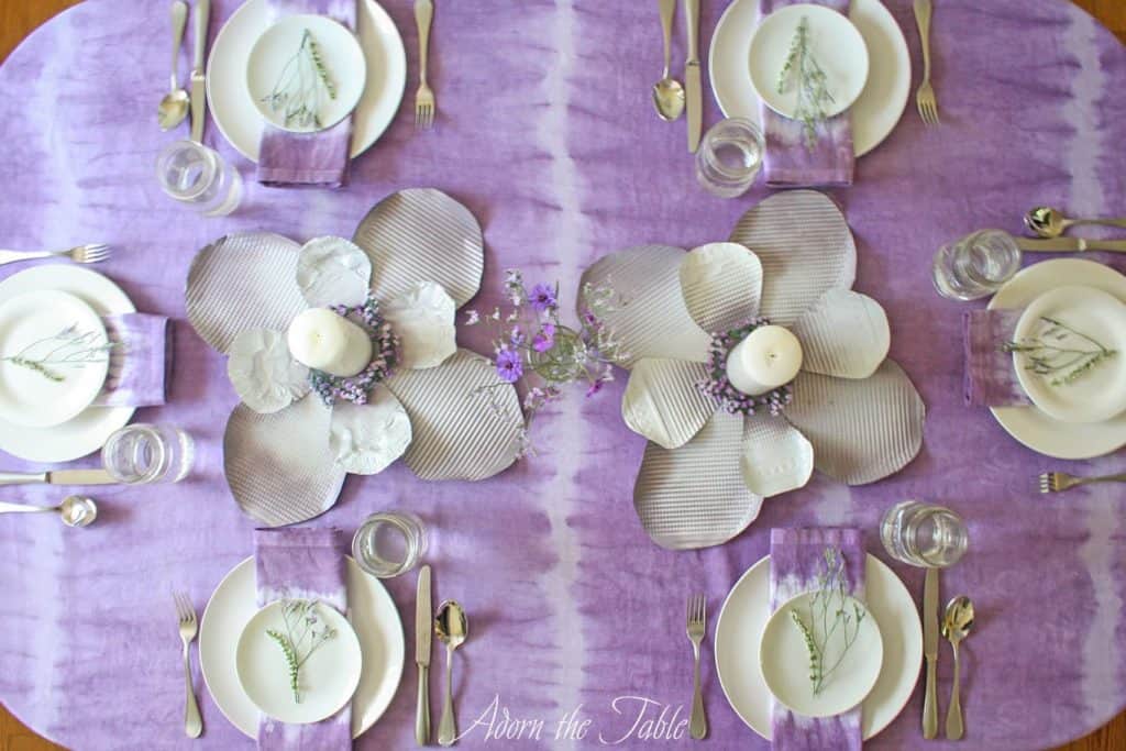 Overhead view of lilac and white boho table setting