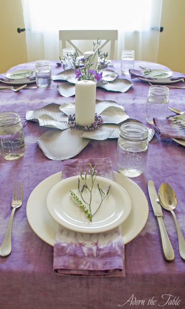 View of lilac and white tablescape from foot of the table