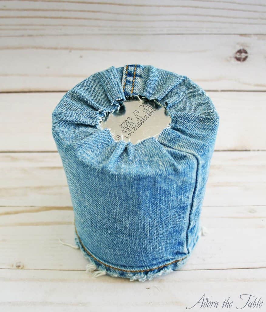Bottom of coffee can with denim glued down