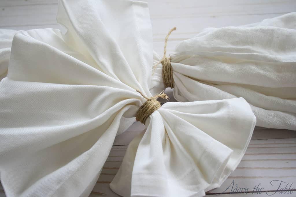 Close up of twine tied around tablecloth and napkins before tie-dyeing