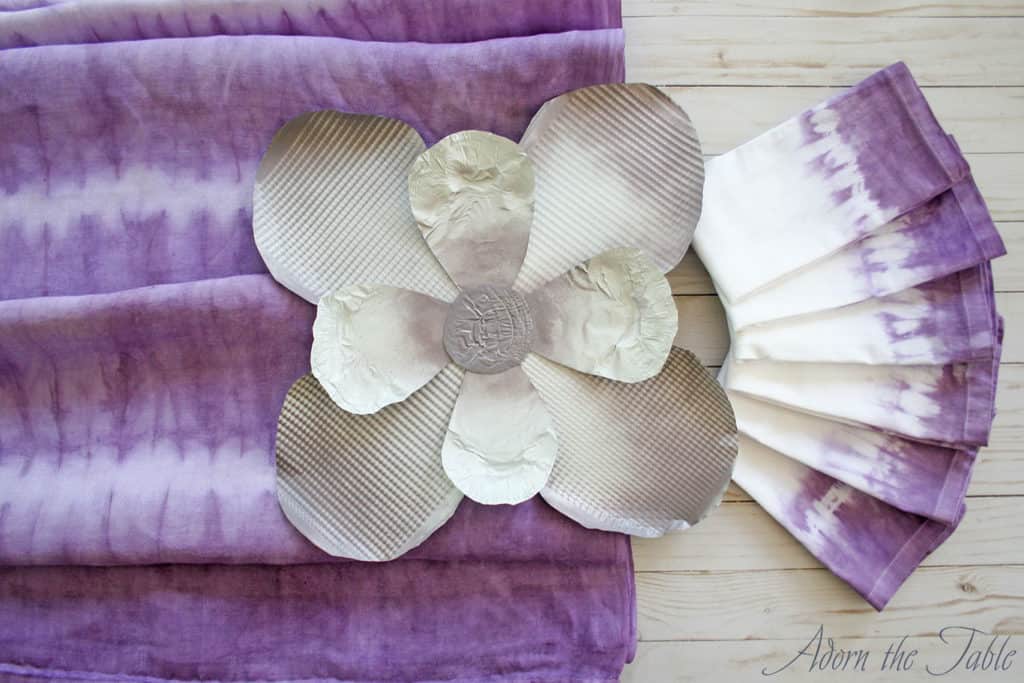 Tie-dyed-tablecloth-napkin-and-metal-cookie-sheet-flower