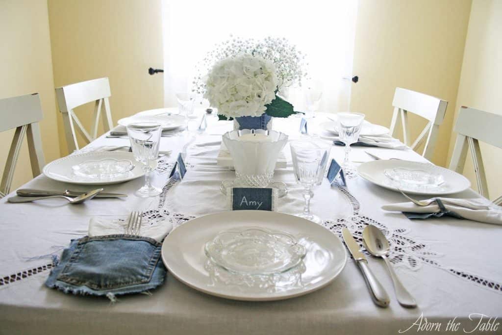 Denim and white lace tablescape. View from the head of the table.