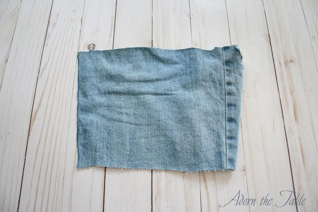 Cut piece of denim from old jeans
