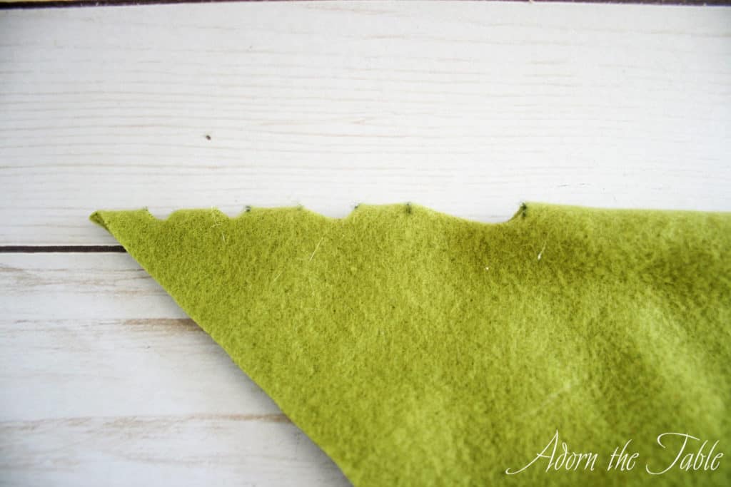 Green fleece with cuts where marks were made