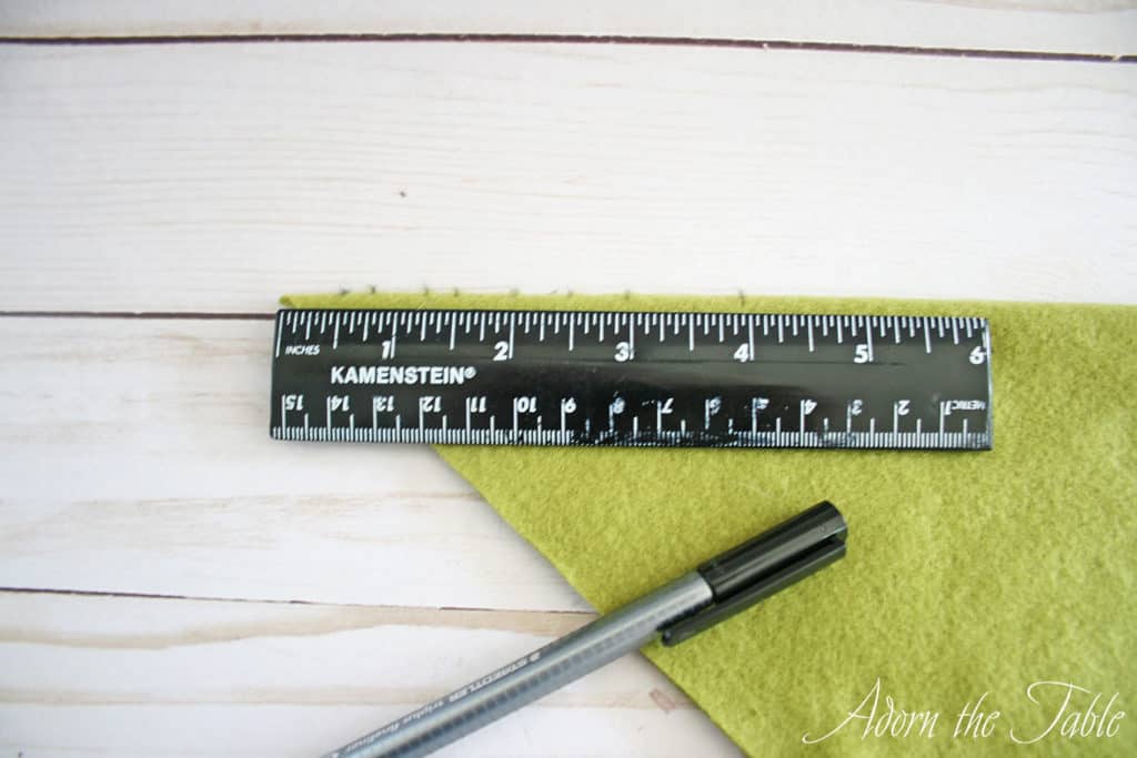 Green fleece with ruler to mark cuts