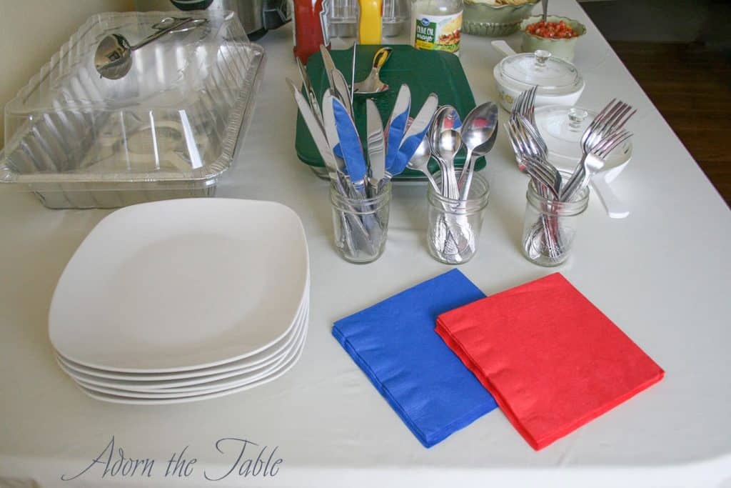 Mistakes Setting up a buffet with flatware next to plates.