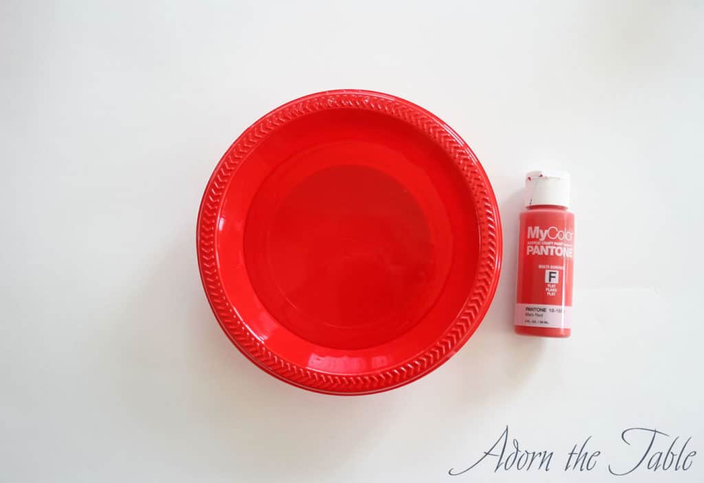 Red acrylic paint and bowl