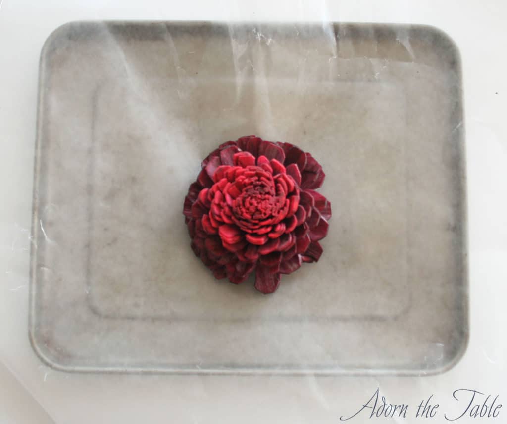 Sola wood flower drying on wax paper