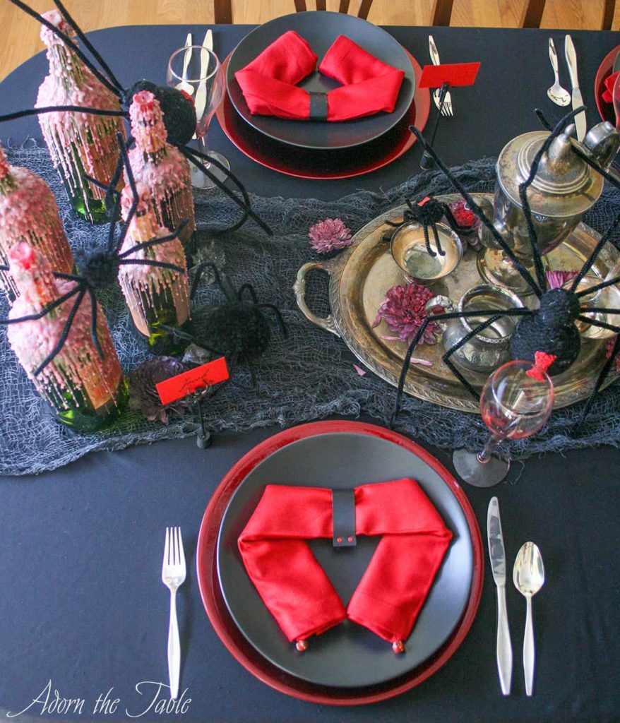 Overhead view of left side of creepy halloween table setting