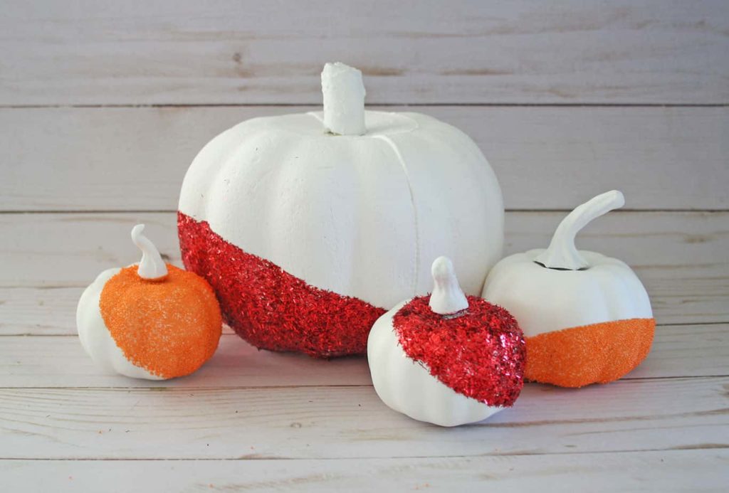 Modern glitter pumpkins. White with red and orange glitter.