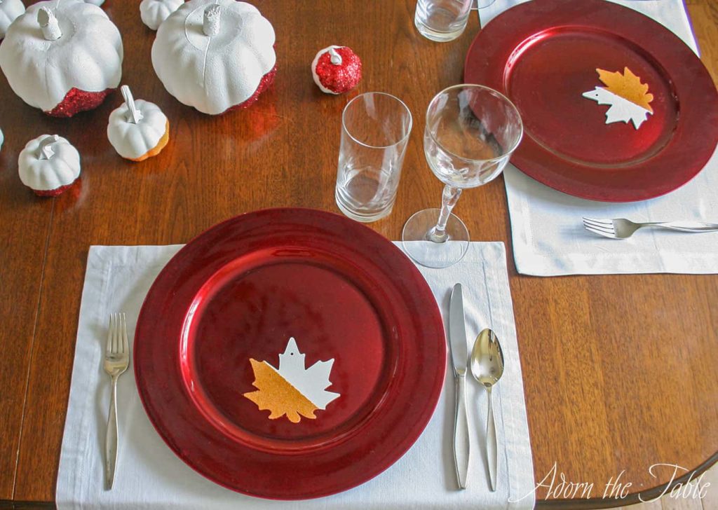 Modern Thanksgiving day place setting with white napkin as a placemat.