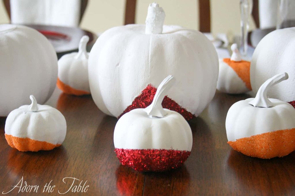 Glitter pumpkins in white, with red and orange glitter.