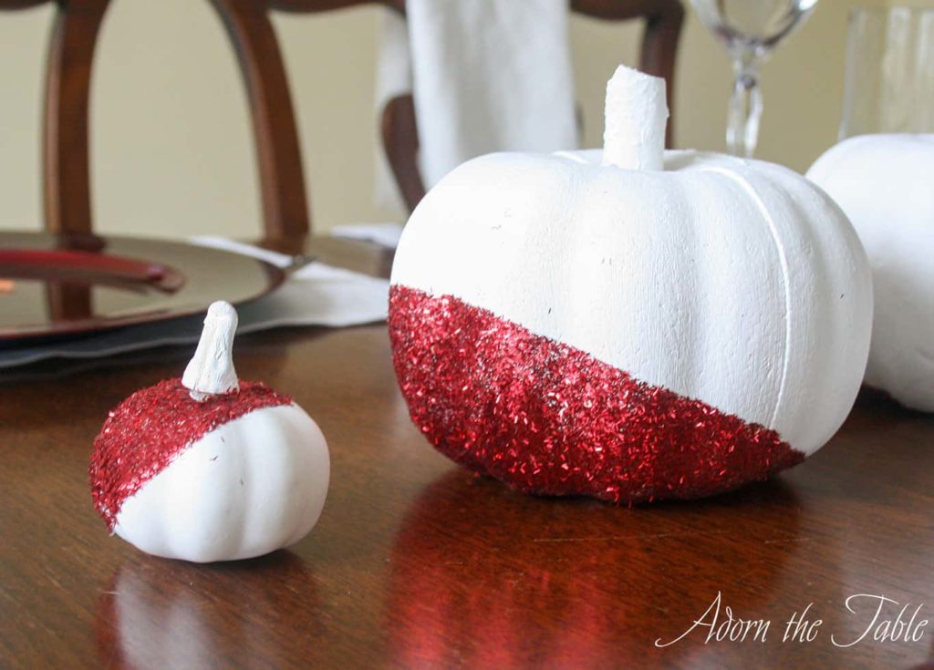 Modern pumpkins in white, with red and orange glitter.