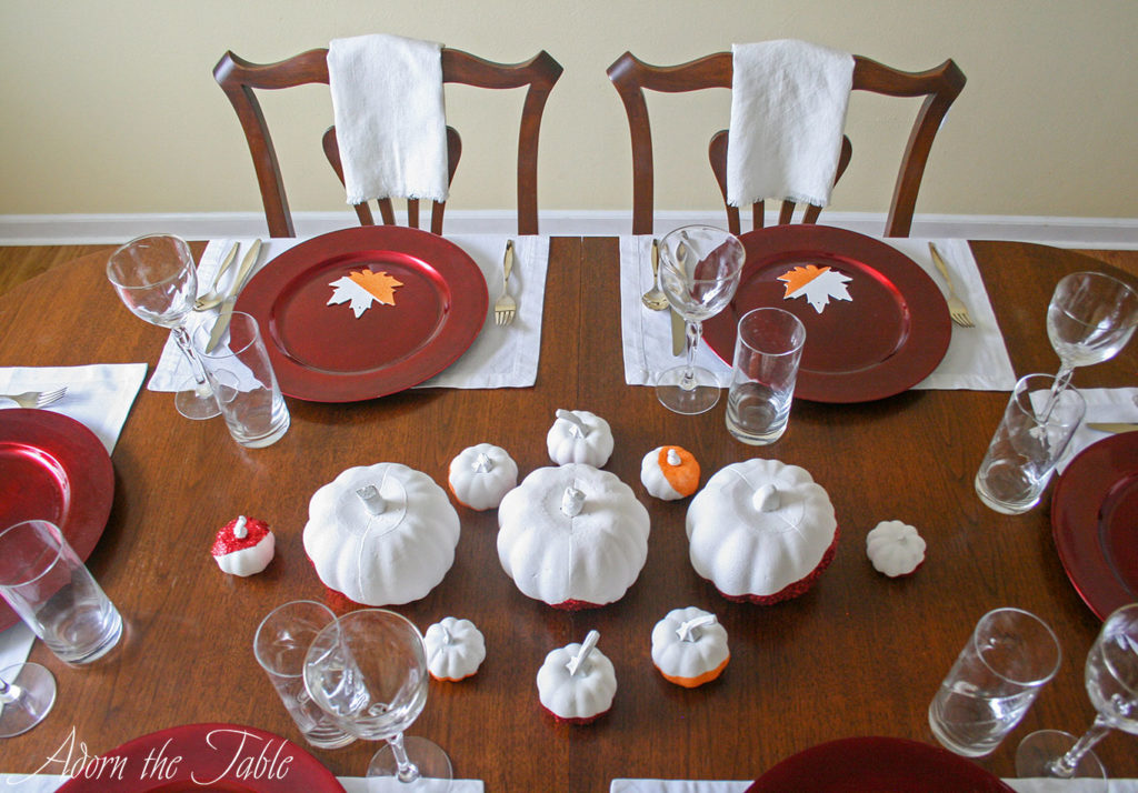 Upper angle of two simple Thanskgiving Day place settings.