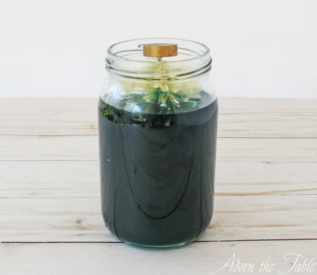 Natural bottle brush tree sitting in jar with RIT dye