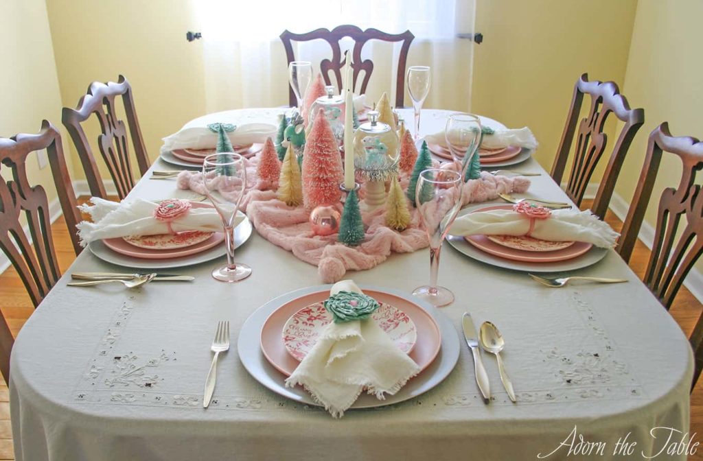 View of pink and green retro Christmas tablescape from the head of the table.