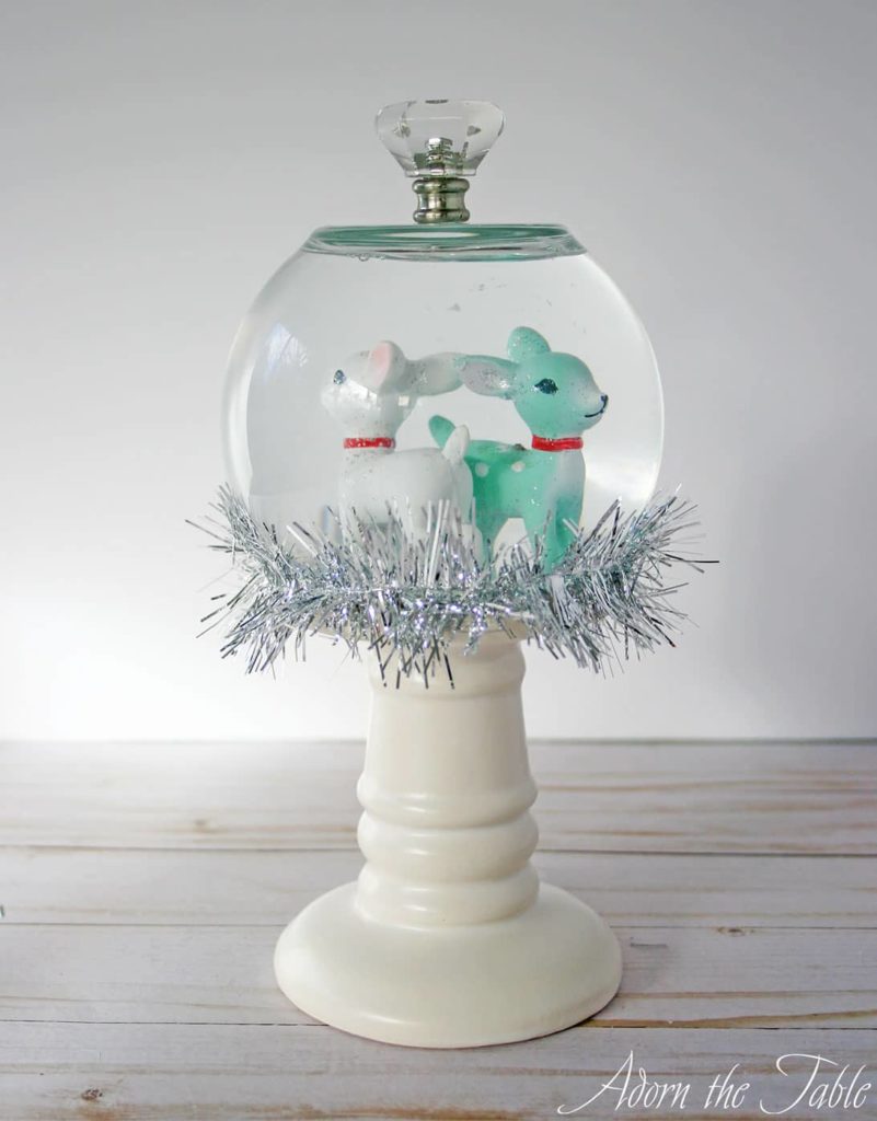 Completed diy snow globe with finial on top. 