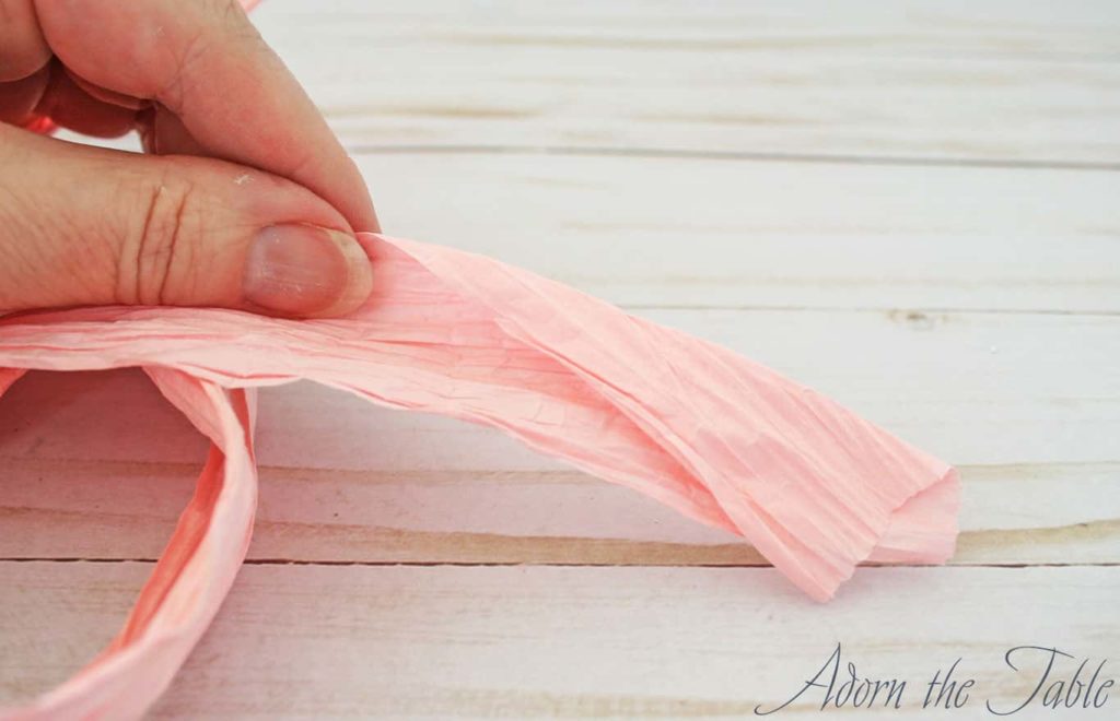Pink twisted paper cord with diagonal fold