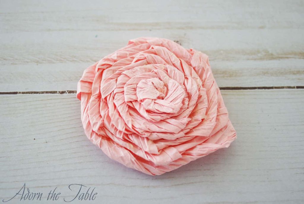 Completed pink twisted paper flower.