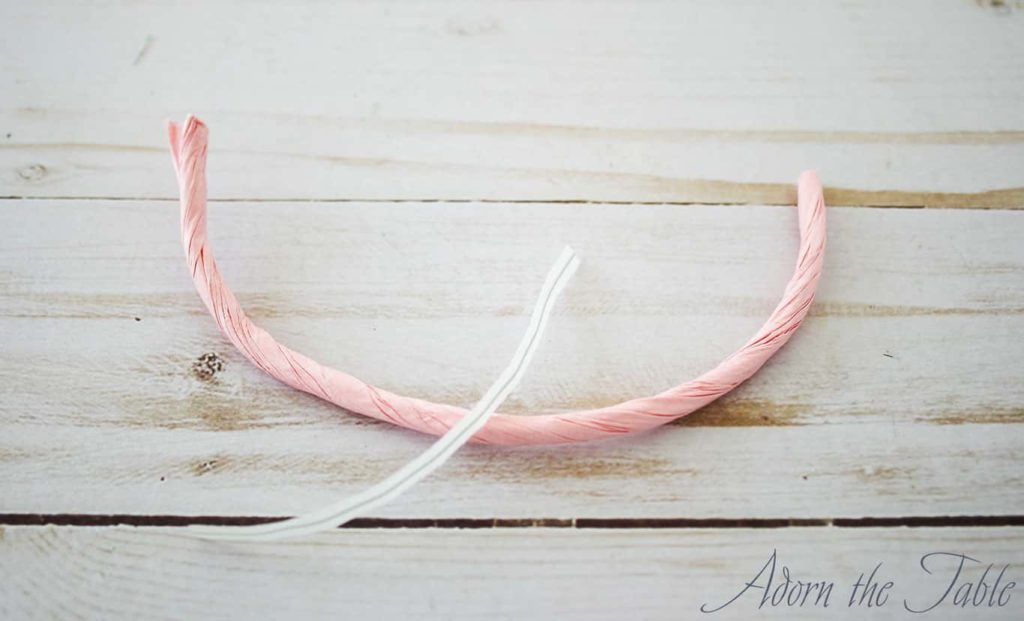 Twist tie and pink twisted paper cord