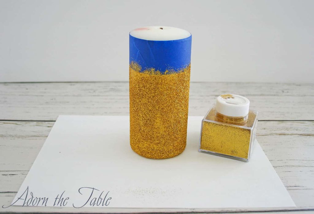 Candle covered with gold glitter