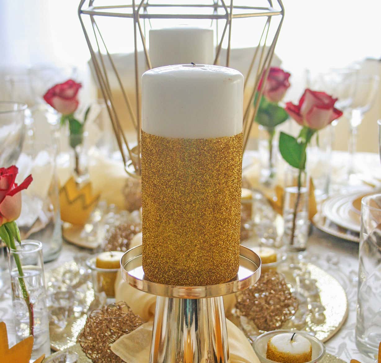 Gold glitter candle on table