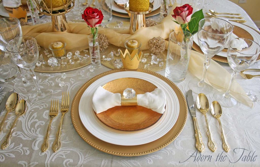 Distant view of gold and white place setting