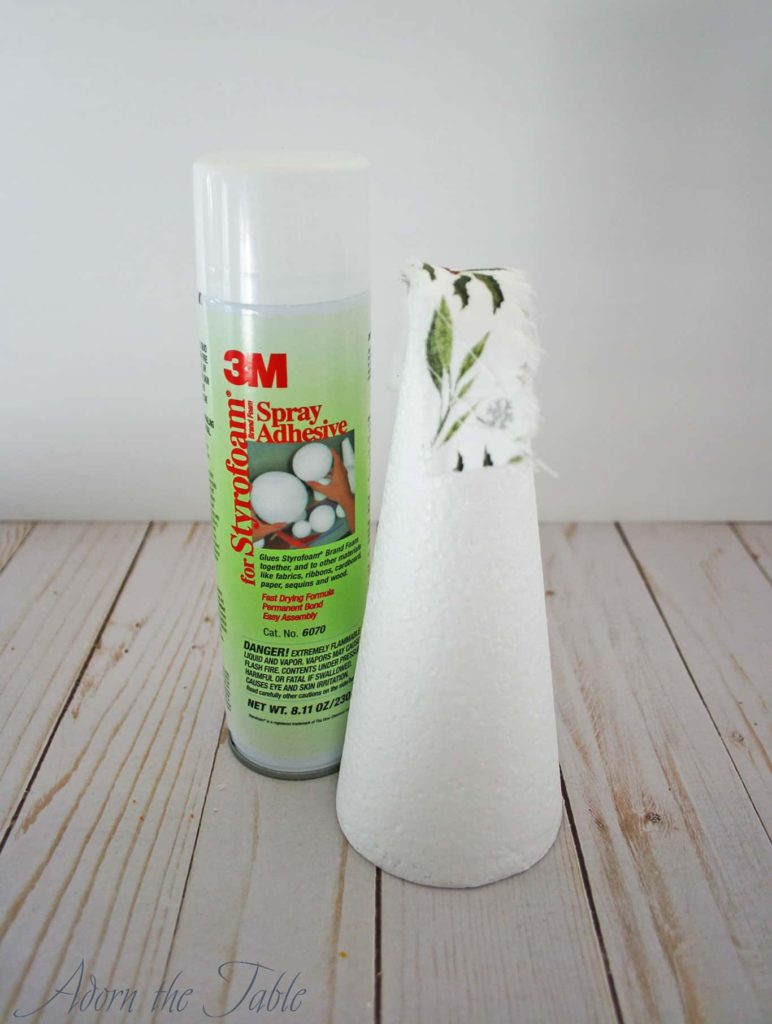 Spray adhesive next to white foam cone