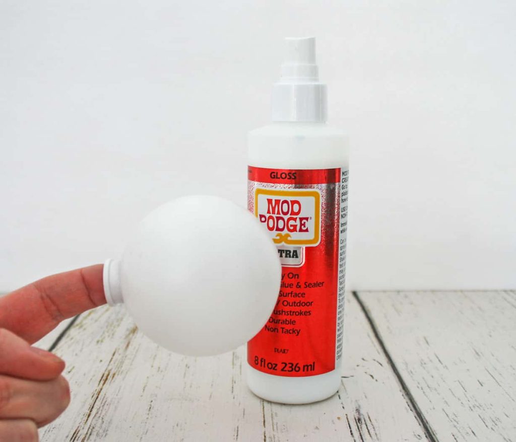 White ball and adhesive spray