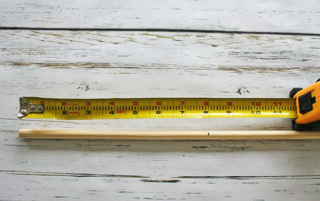 Tape measure and wooden dowel