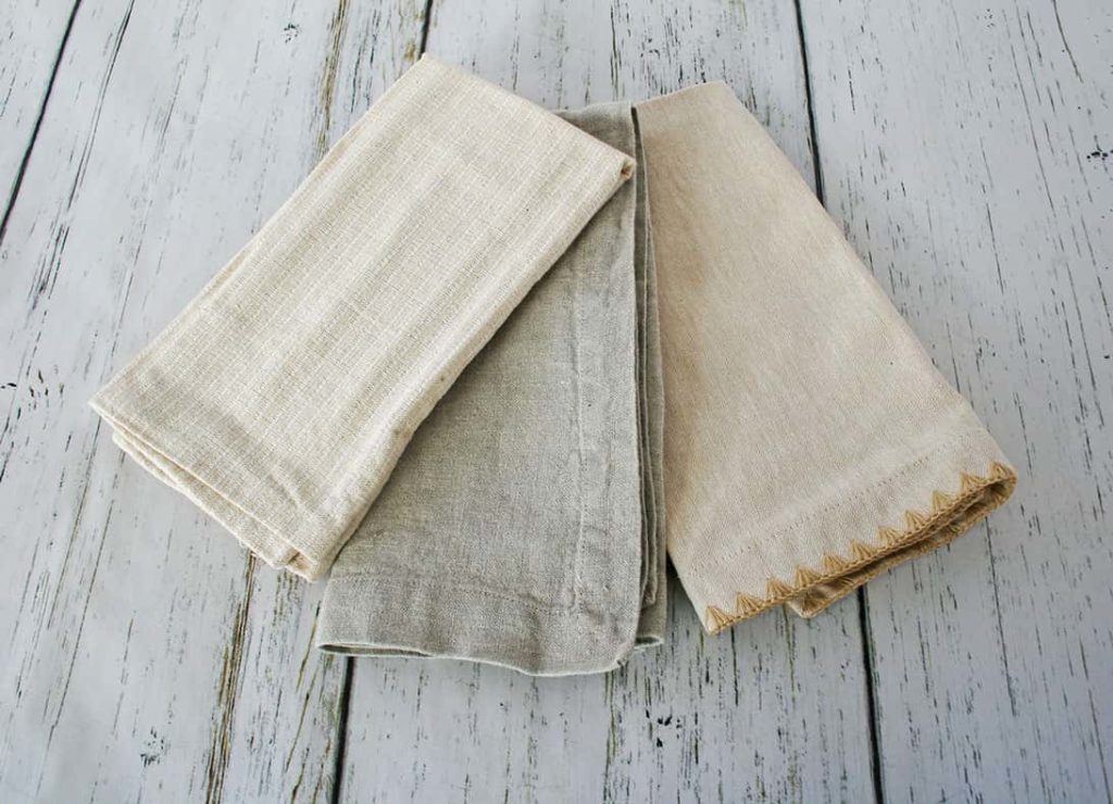 Close up of best neutral napkins in 3 styles.