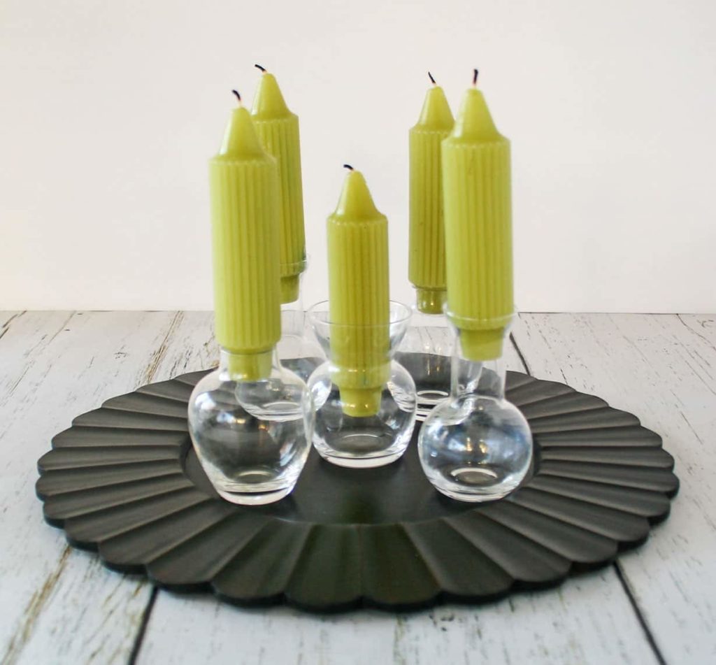 Bud vases with candles in them.