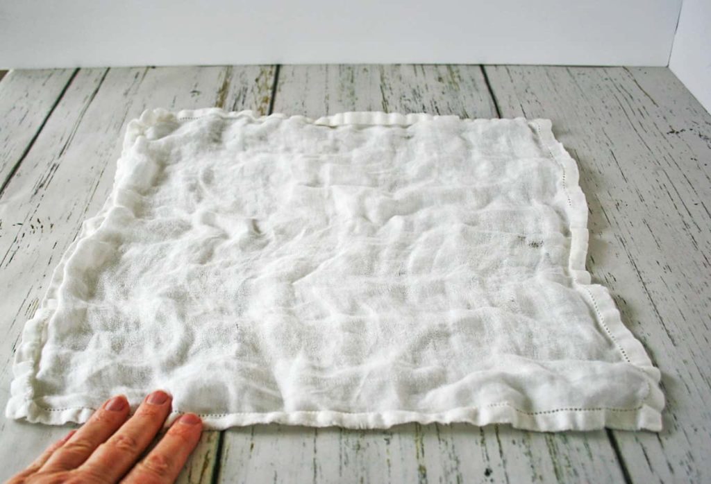 Remove wrinkles from tablecloths using fingers