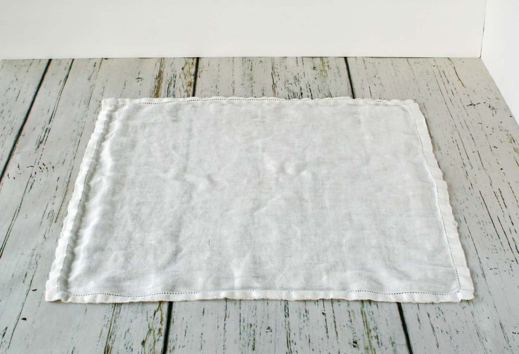 Wrinkles removed from tablecloth using iron