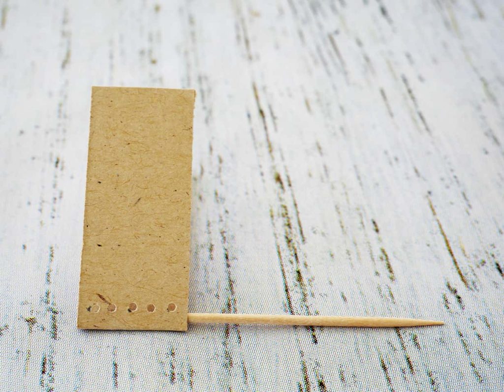 Toothpick inside cheese marker paper