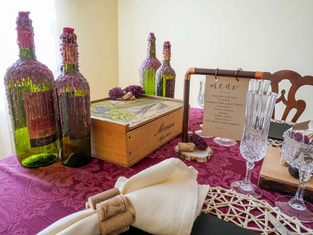 Wine box and wine bottles on table