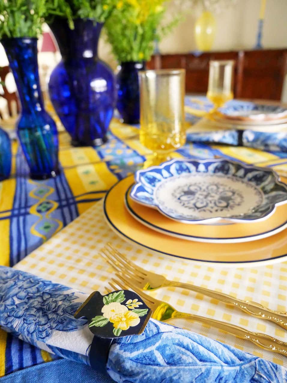 Napkin ring on blue and yellow tablescape