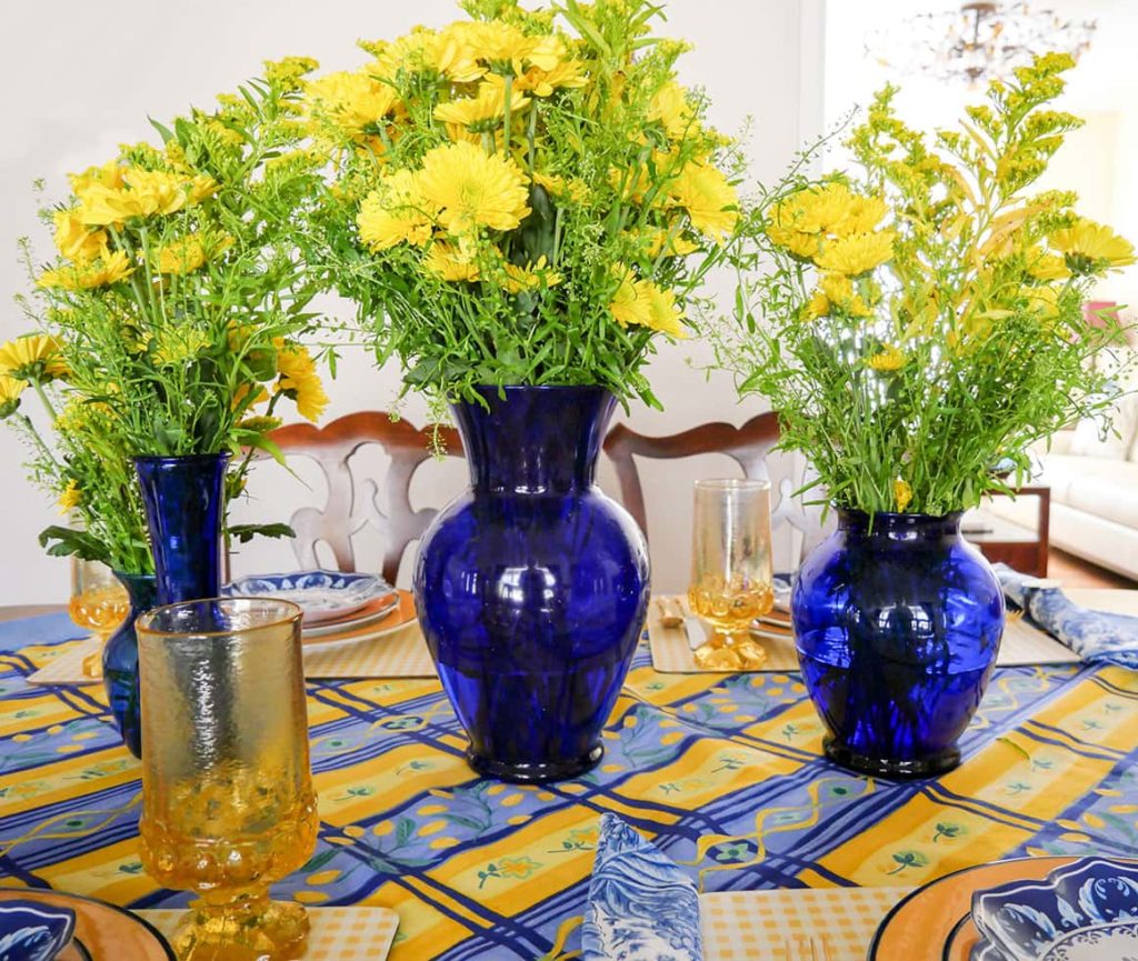 Vases in the middle of the Blue and yellow tablescape for Spring 