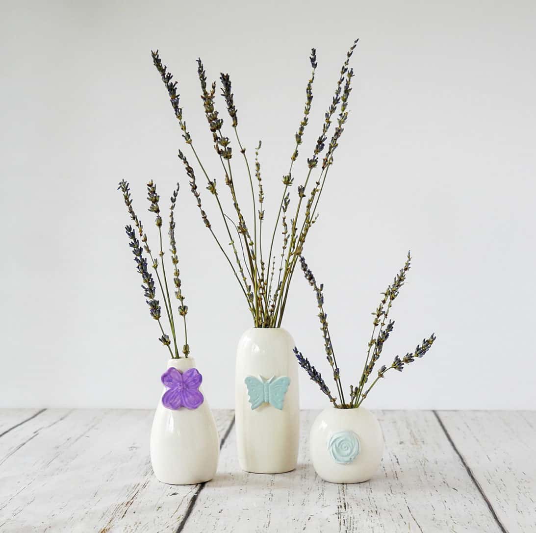 Plaster pieces attached to bud vases