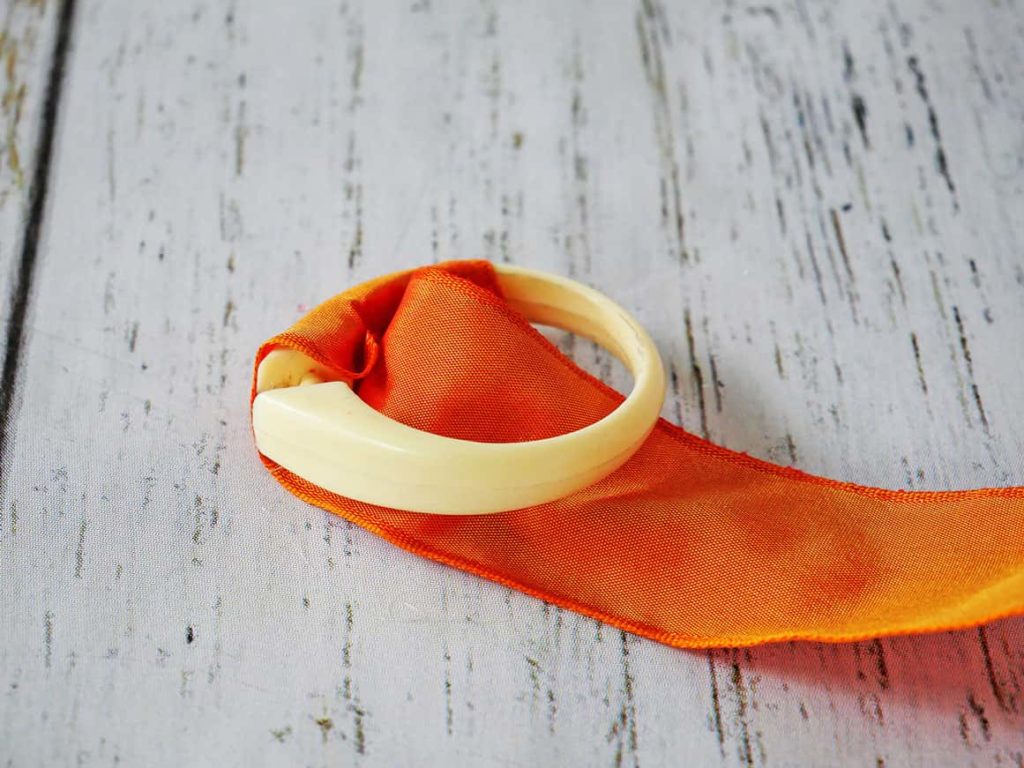 Wrapping DIY Easter Napkin Ring with ribbon